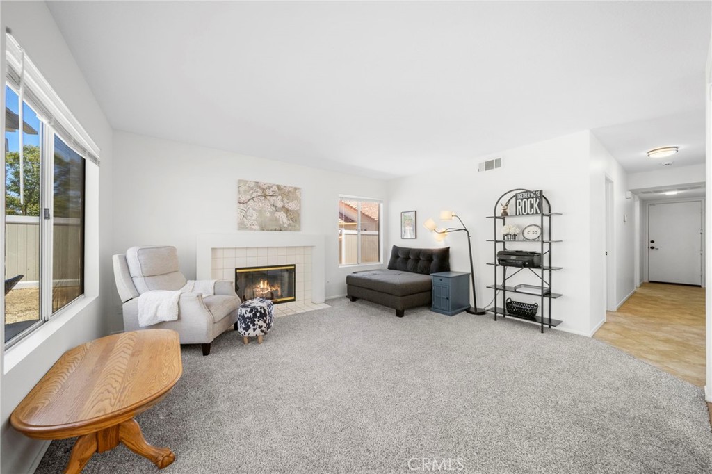 9253 Sunridge Drive Riverside, CA 92508 - Photo 22 of 57 a bed room with furniture and a fireplace