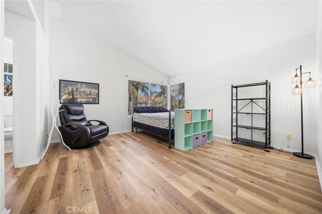 9253 Sunridge Drive Riverside, CA 92508 - Photo 25 of 57 a view of a bedroom with furniture and natural light
