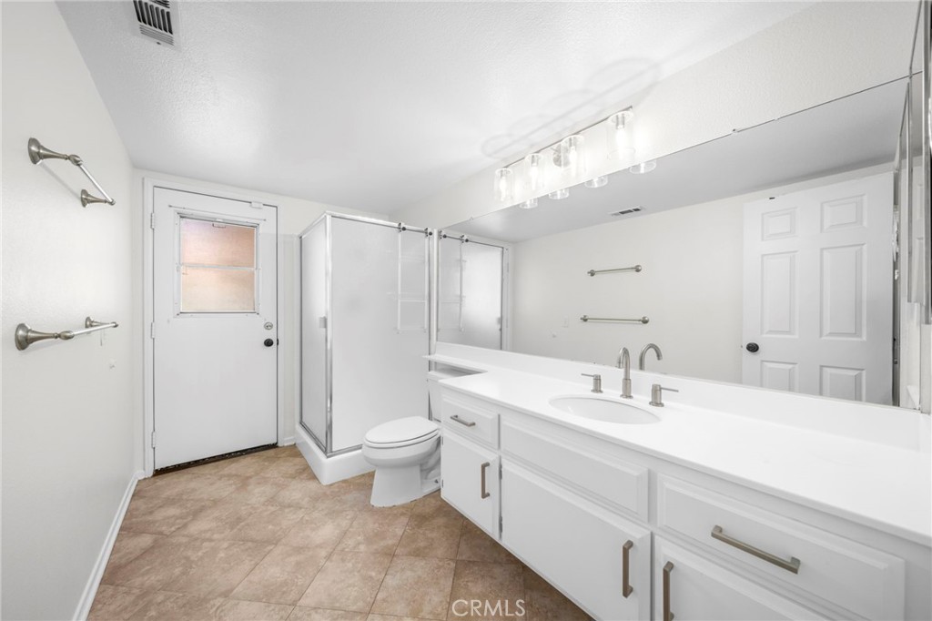9253 Sunridge Drive Riverside, CA 92508 - Photo 32 of 57 a bathroom with a sink a toilet and shower