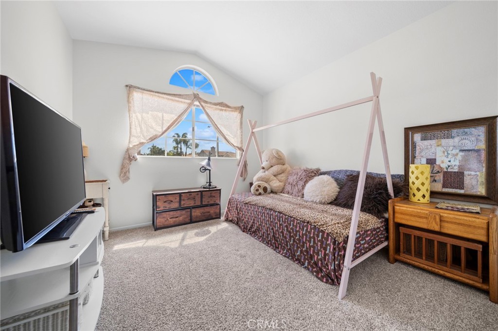 9253 Sunridge Drive Riverside, CA 92508 - Photo 33 of 57 a bedroom with furniture and a flat screen tv