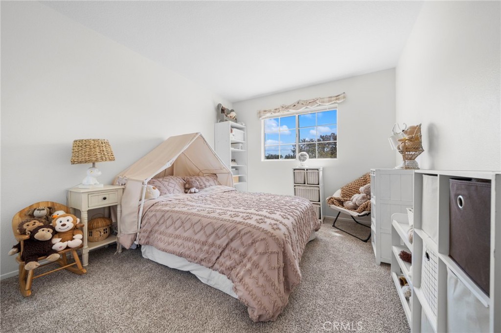 9253 Sunridge Drive Riverside, CA 92508 - Photo 36 of 57 a bedroom with a bed and a tv