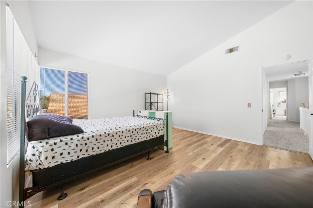 9253 Sunridge Drive Riverside, CA 92508 - Photo 42 of 57 a bedroom with a bed and a window