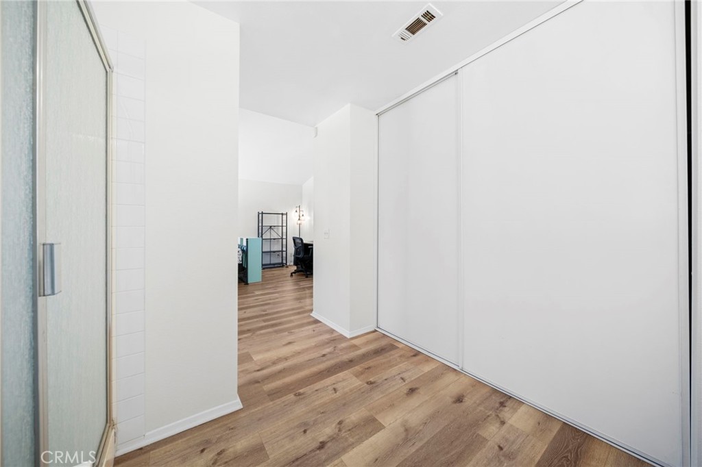 9253 Sunridge Drive Riverside, CA 92508 - Photo 43 of 57 a view of a hallway with wooden floor