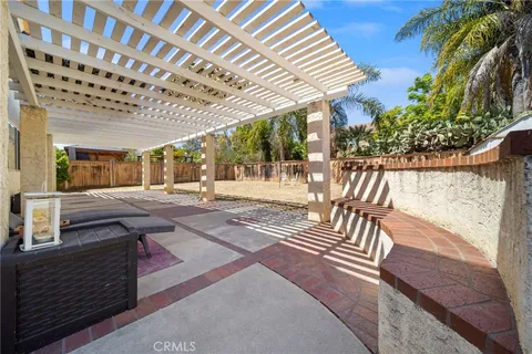 aerial view of residential houses with outdoor space and swimming pool