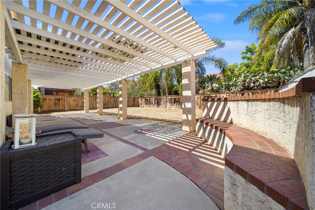 9253 Sunridge Drive Riverside, CA 92508 - Photo 46 of 57 a view of a patio with a table and chairs and potted plants