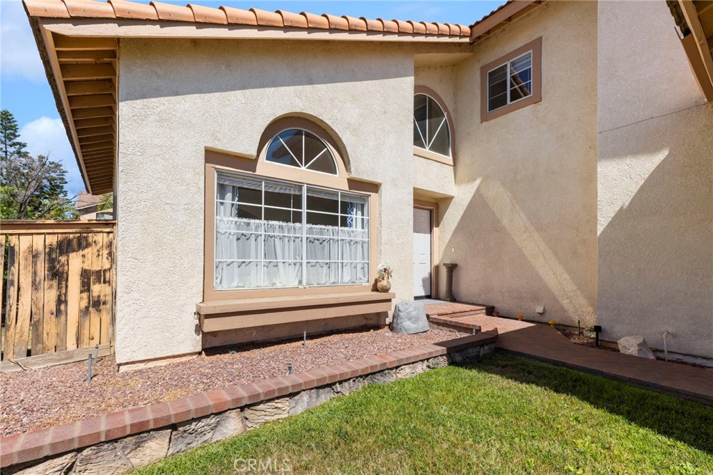 9253 Sunridge Drive Riverside, CA 92508 - Photo 5 of 57 a front view of a house with garden