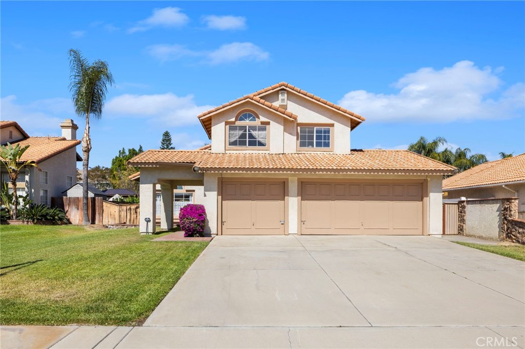 9253 Sunridge Drive Riverside, CA 92508 - Photo 56 of 57 a front view of a house with a yard