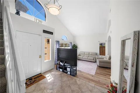 a view of a livingroom with furniture and a flat screen tv