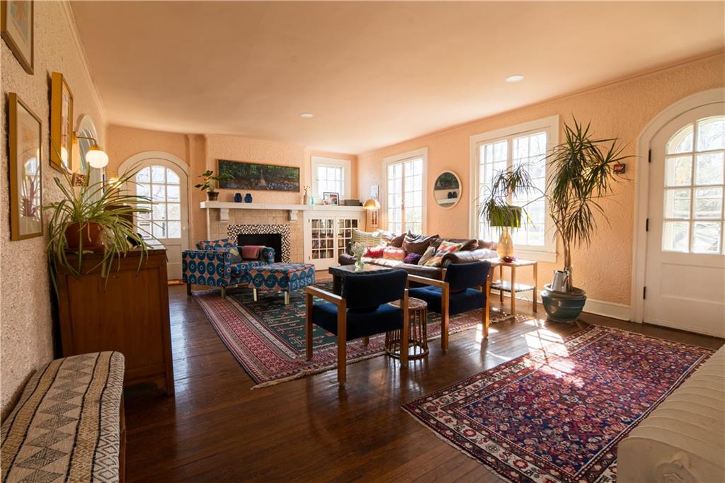 6673 Kinsman Road Pittsburgh, PA 15217 - Photo 2 of 50 a living room with fireplace furniture and a rug