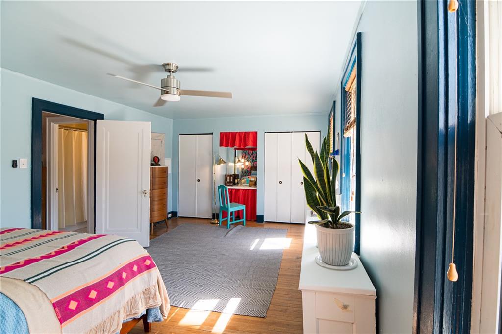6673 Kinsman Road Pittsburgh, PA 15217 - Photo 21 of 50 a living room with a bed furniture and a window