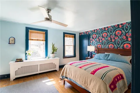 a bedroom with bed and window