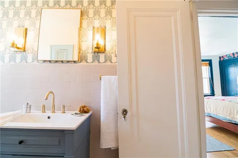 a bathroom with a sink and a mirror