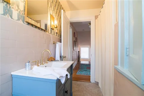 a bathroom with a sink and a mirror