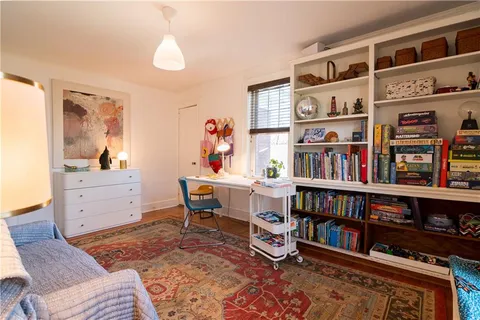 a workspace with a book shelf