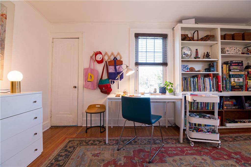 6673 Kinsman Road Pittsburgh, PA 15217 - Photo 27 of 50 a room with bookshelf and a window