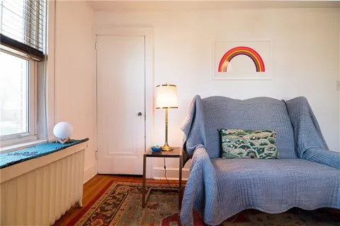 a bedroom with bed and a window
