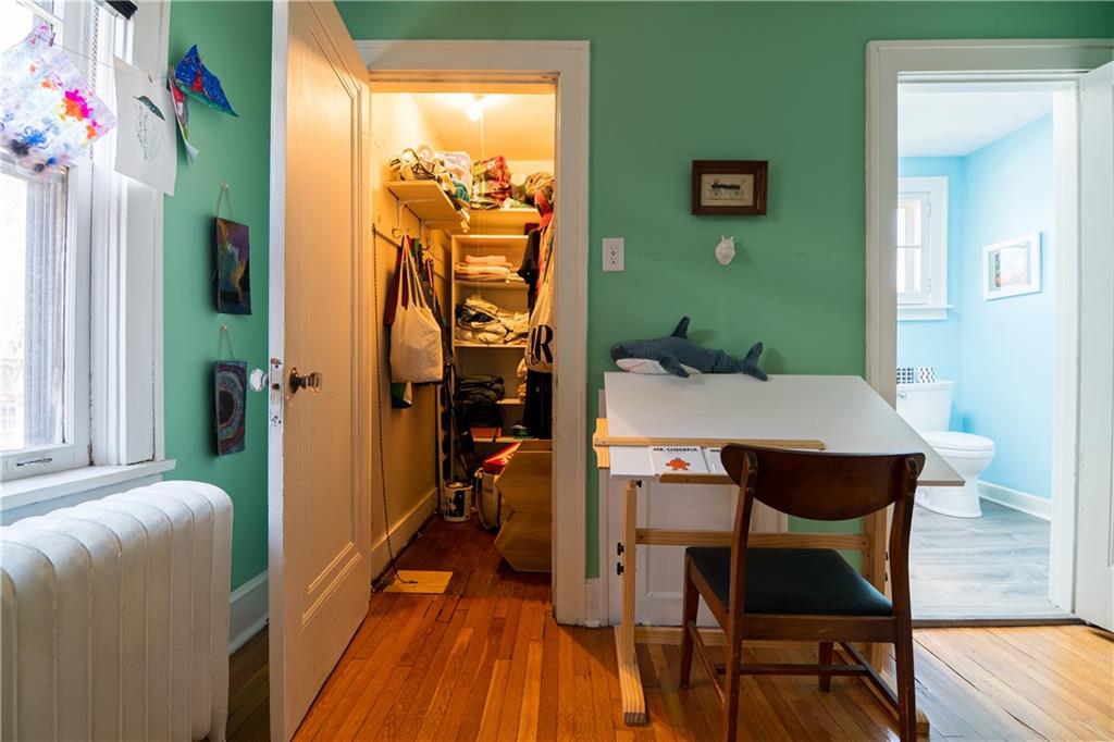 6673 Kinsman Road Pittsburgh, PA 15217 - Photo 30 of 50 a dining room with furniture and wooden floor