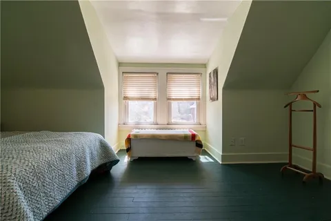 a bed room with a bed and a window