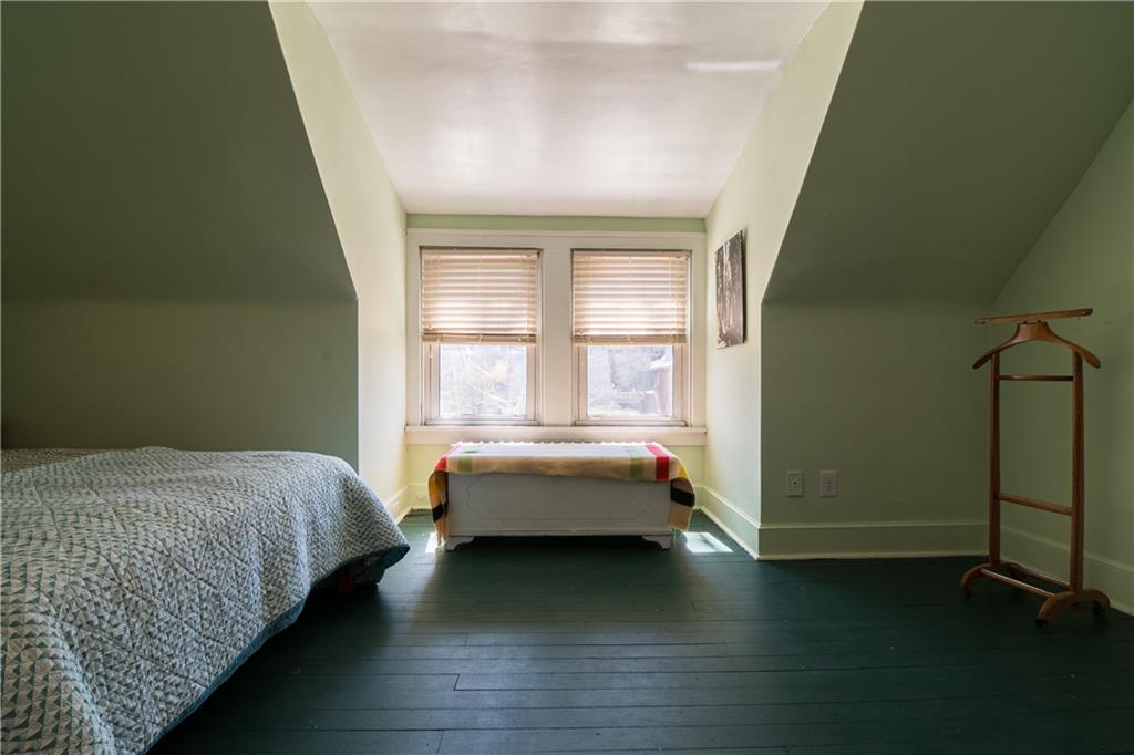 6673 Kinsman Road Pittsburgh, PA 15217 - Photo 36 of 50 a bed room with a bed and a window