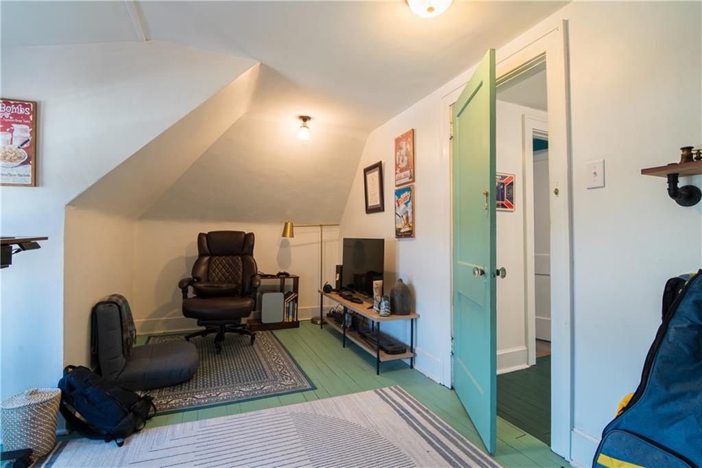 6673 Kinsman Road Pittsburgh, PA 15217 - Photo 38 of 50 a living room with furniture and a flat screen tv