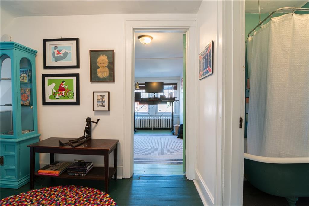 6673 Kinsman Road Pittsburgh, PA 15217 - Photo 39 of 50 a living room with furniture and painting on the wall