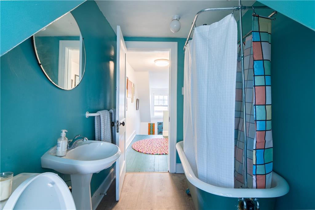 6673 Kinsman Road Pittsburgh, PA 15217 - Photo 40 of 50 a view of a bathroom with a toilet and a mirror