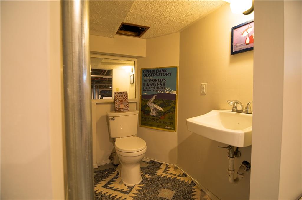 6673 Kinsman Road Pittsburgh, PA 15217 - Photo 42 of 50 a bathroom with a sink toilet and shower