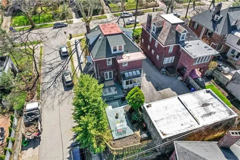 an aerial view of a house with a garden