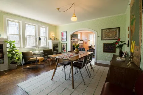 a view of a dining room with furniture window and outside view
