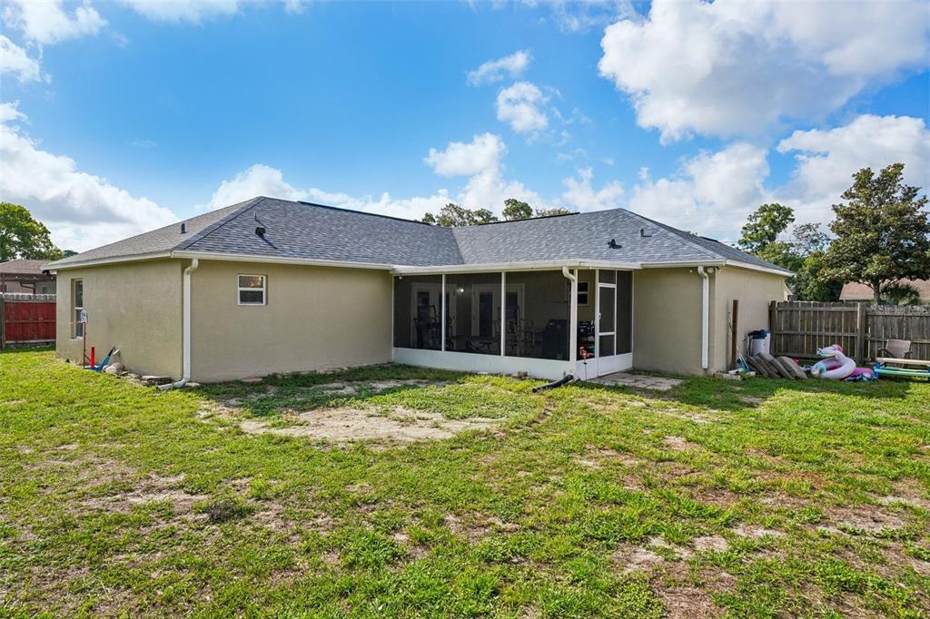 10303 Fordham Street Spring Hill, FL 34608 - Photo 21 of 25 a view of a house with backyard and garden