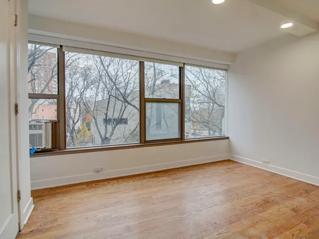an empty room with large window