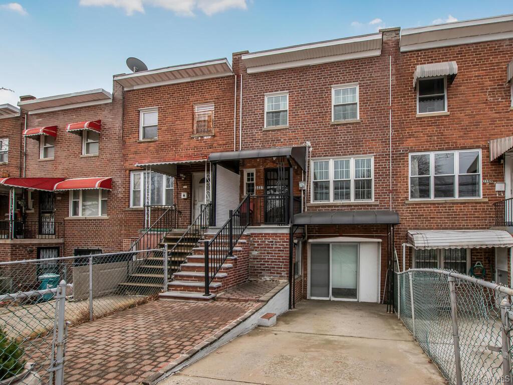 a front view of building with yard