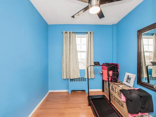 a bedroom with bed and a window