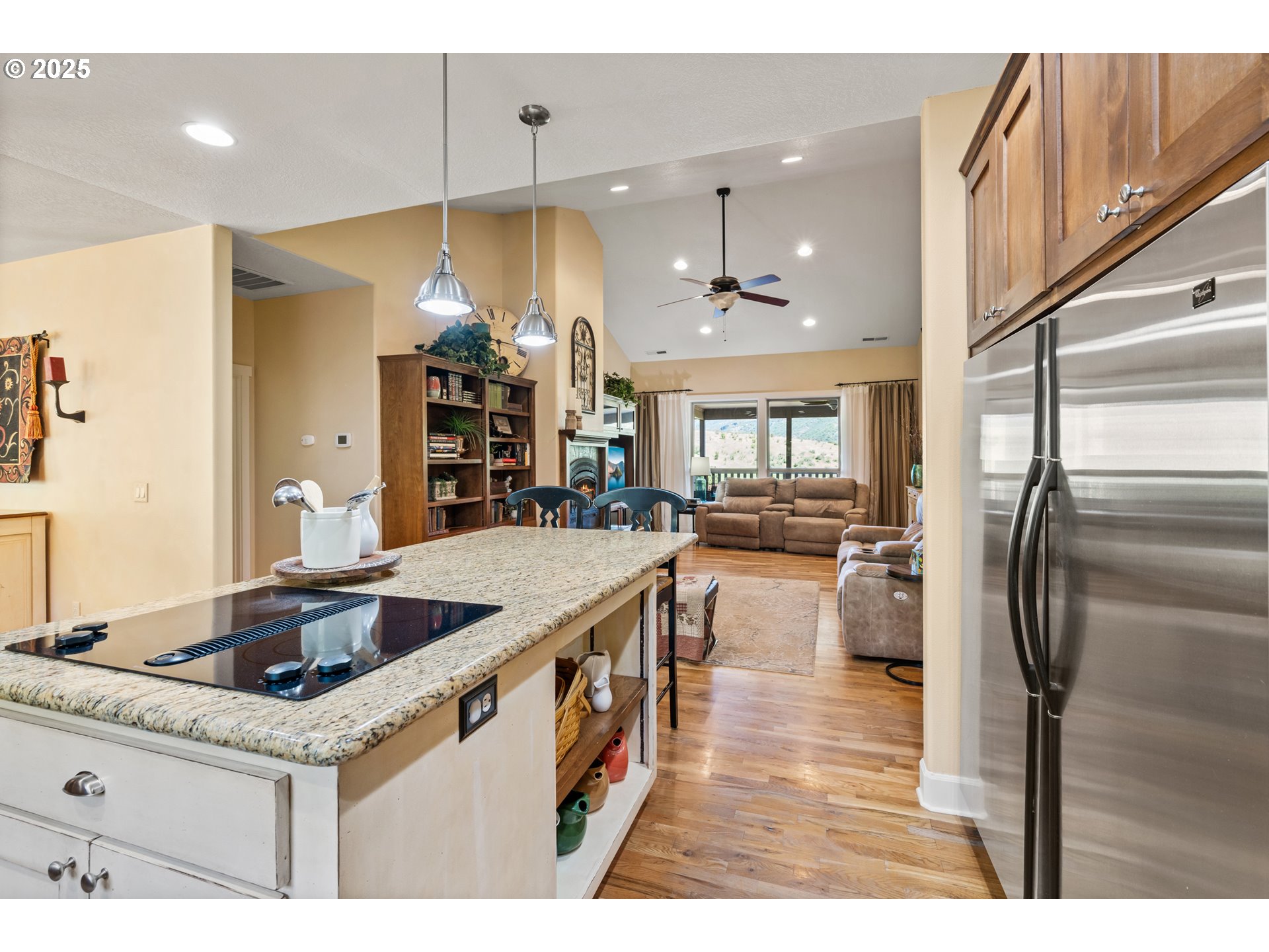 2809 Dead Indian Memorial Road Ashland, OR 97520 - Photo 12 of 45 a kitchen with stainless steel appliances granite countertop a sink and a refrigerator