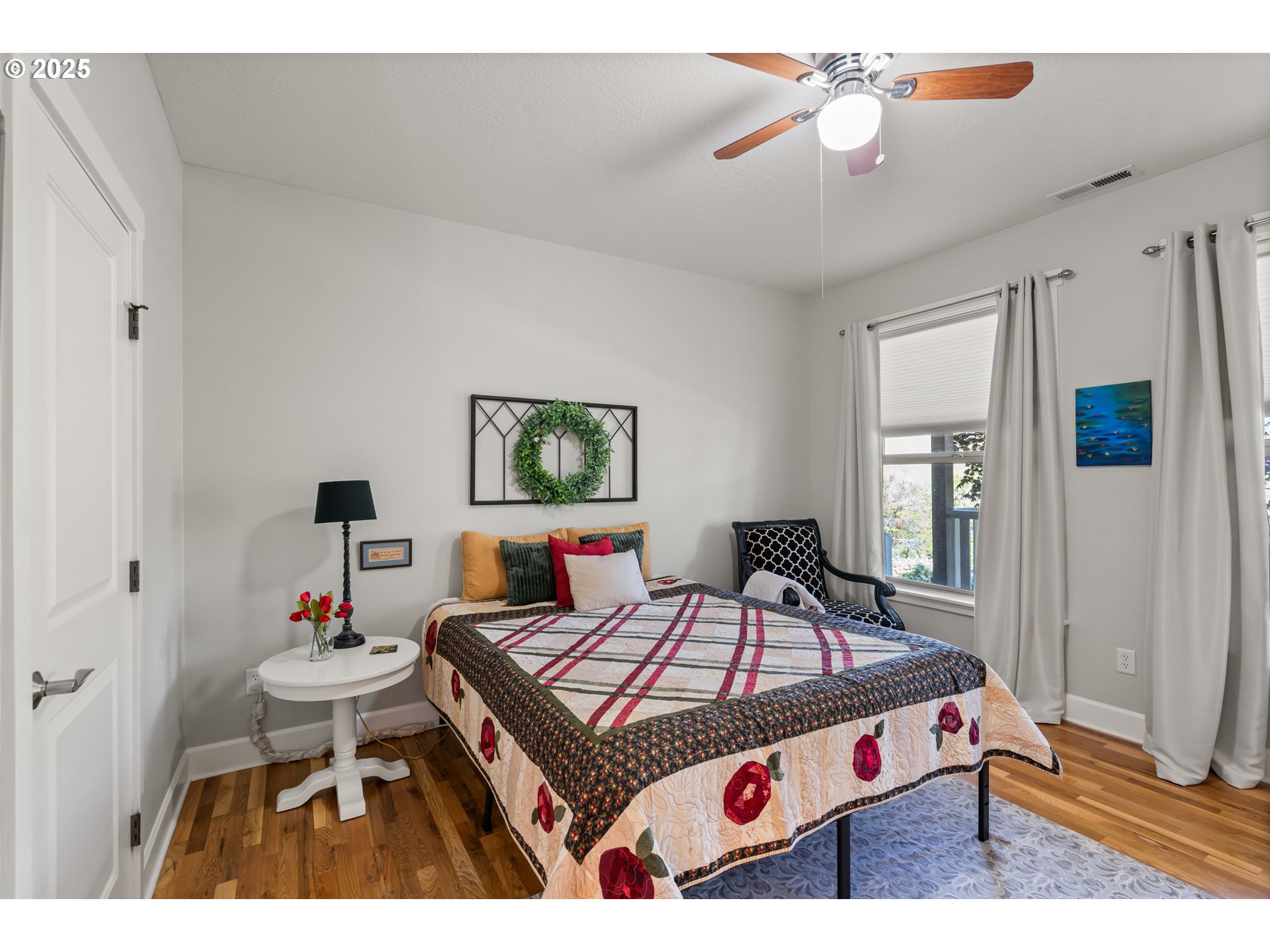 2809 Dead Indian Memorial Road Ashland, OR 97520 - Photo 23 of 45 a bedroom with a bed and a chandelier