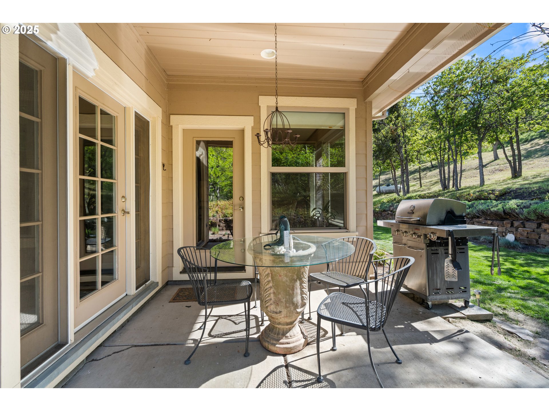2809 Dead Indian Memorial Road Ashland, OR 97520 - Photo 33 of 45 a patio with yard glass top table and chairs