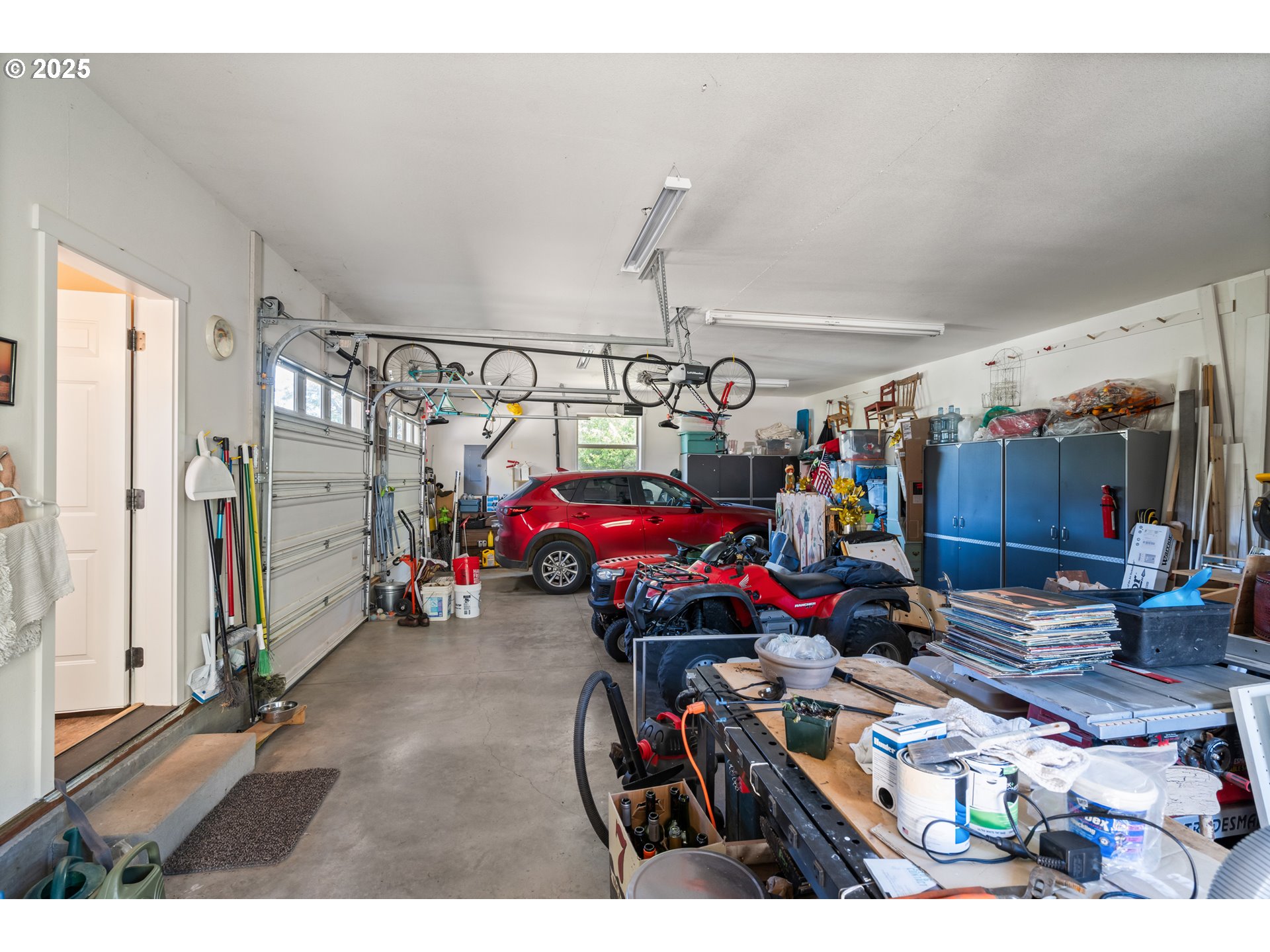 2809 Dead Indian Memorial Road Ashland, OR 97520 - Photo 40 of 45 a view of a garage with a bike and white walls