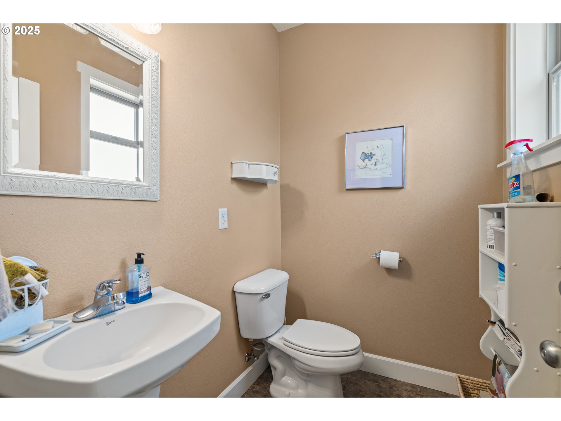 2809 Dead Indian Memorial Road Ashland, OR 97520 - Photo 41 of 45 a bathroom with a toilet a sink and a mirror
