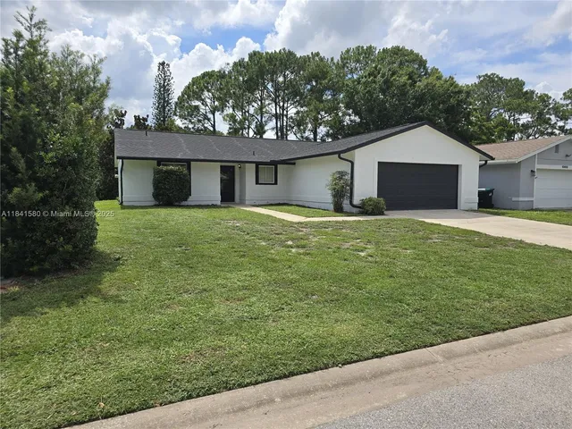 a house view with a garden space