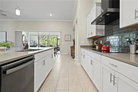 a living room with furniture a bookshelf and a book shelf