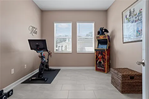a bathroom with a granite countertop toilet a sink and a mirror