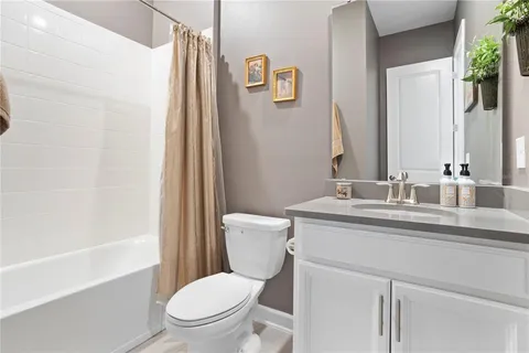 a view of walk in closet with clothes