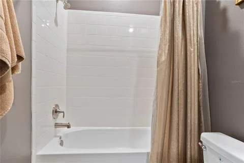 a bedroom with a bed and a walk in closet