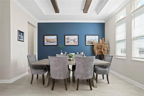 a view of a dining room with furniture and window