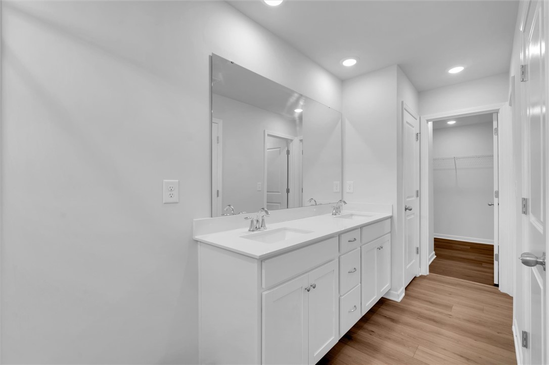 515 Brasstown Court Pendleton, SC 29670 - Photo 13 of 25 This modern primary bathroom features a spacious dual vanity, water closet, linen closet, and walk-in closet.