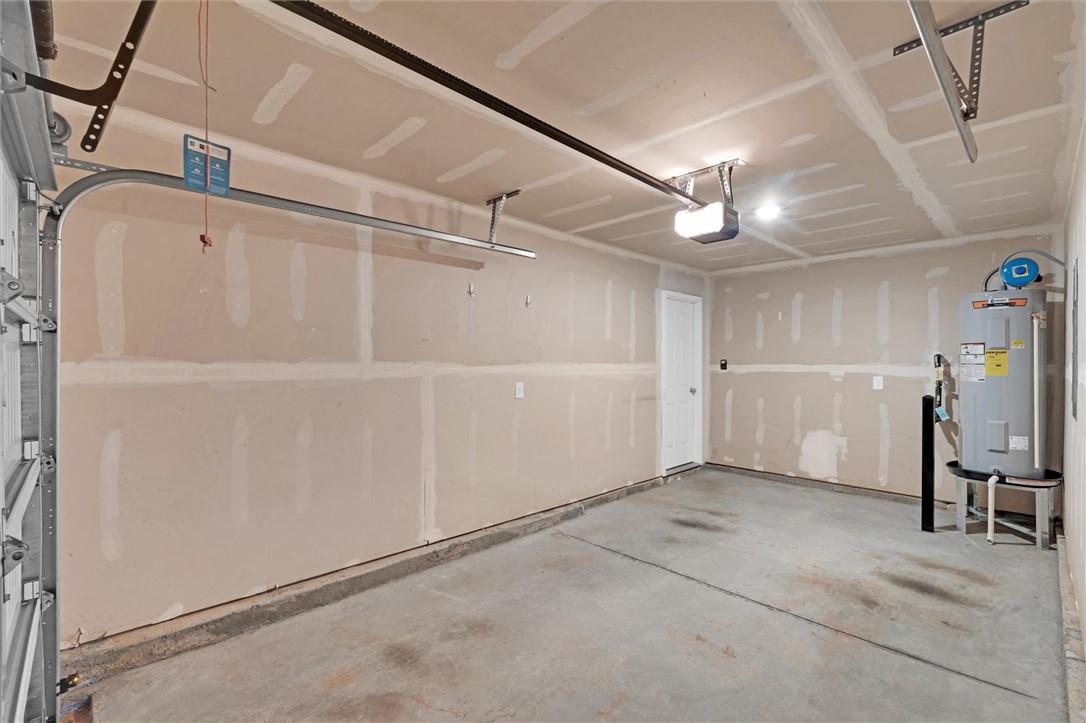 515 Brasstown Court Pendleton, SC 29670 - Photo 20 of 25 This spacious garage offers ample parking for one car and additional storage solutions for your household needs.