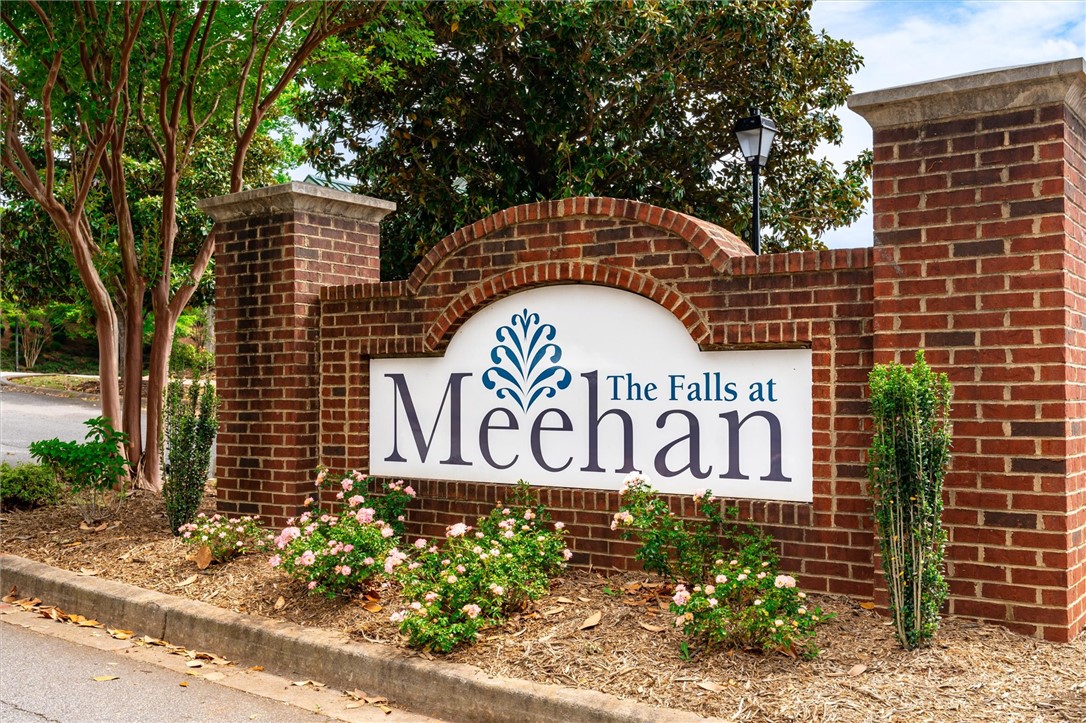 515 Brasstown Court Pendleton, SC 29670 - Photo 23 of 25 Welcome to a distinguished community, marked by a classic brick entrance and vibrant landscaping.