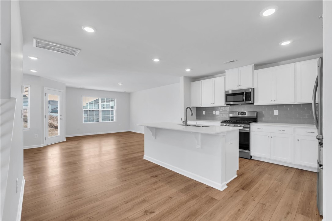 515 Brasstown Court Pendleton, SC 29670 - Photo 5 of 25 This bright and airy kitchen boasts ample counter space and modern appliances, perfect for everyday living.