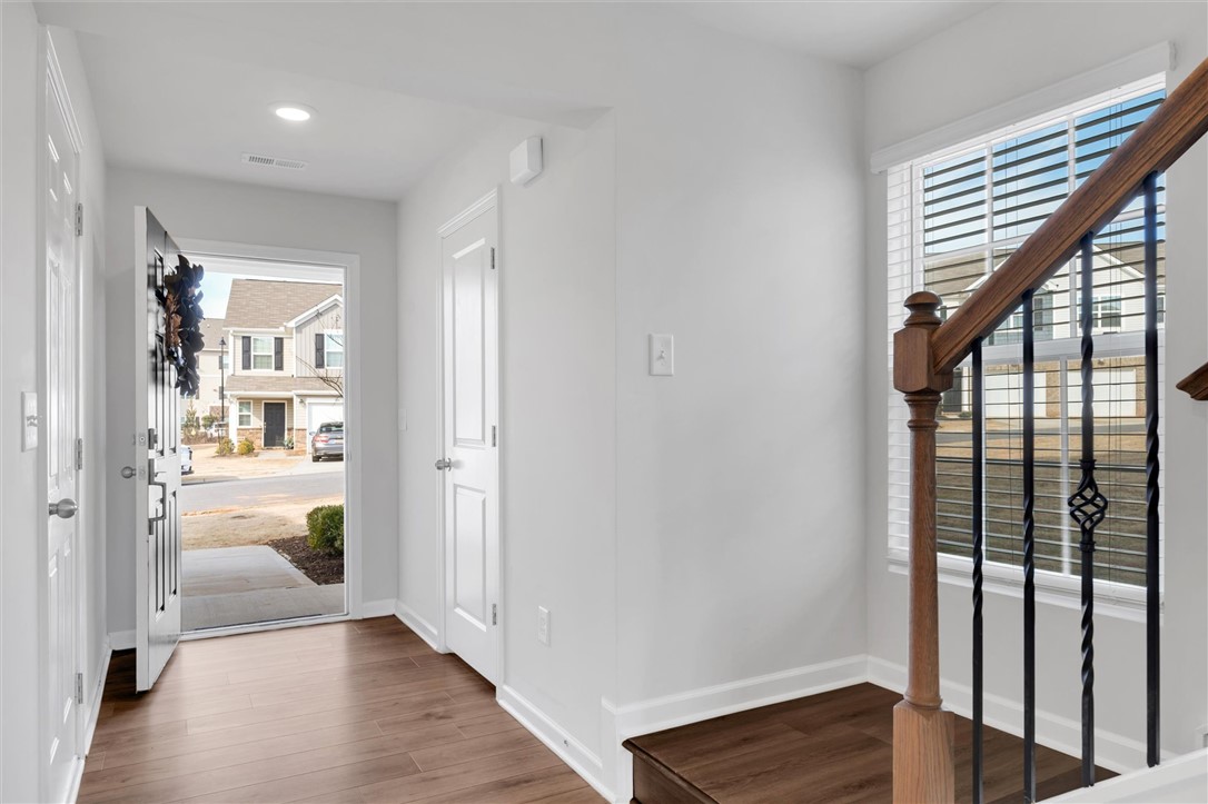 515 Brasstown Court Pendleton, SC 29670 - Photo 8 of 25 This welcoming entryway features a half bath, access to the garage, and a striking staircase.