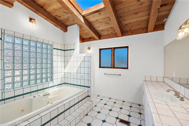 a bathroom with a bathtub and shower